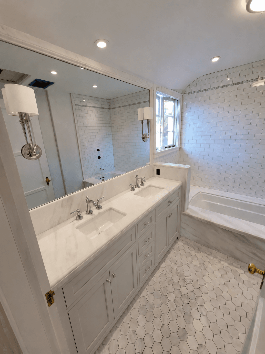 Finished marble double-vanity bathroom in a San Marino home